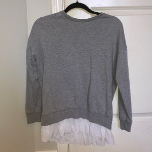 Grey sweater, with white frill